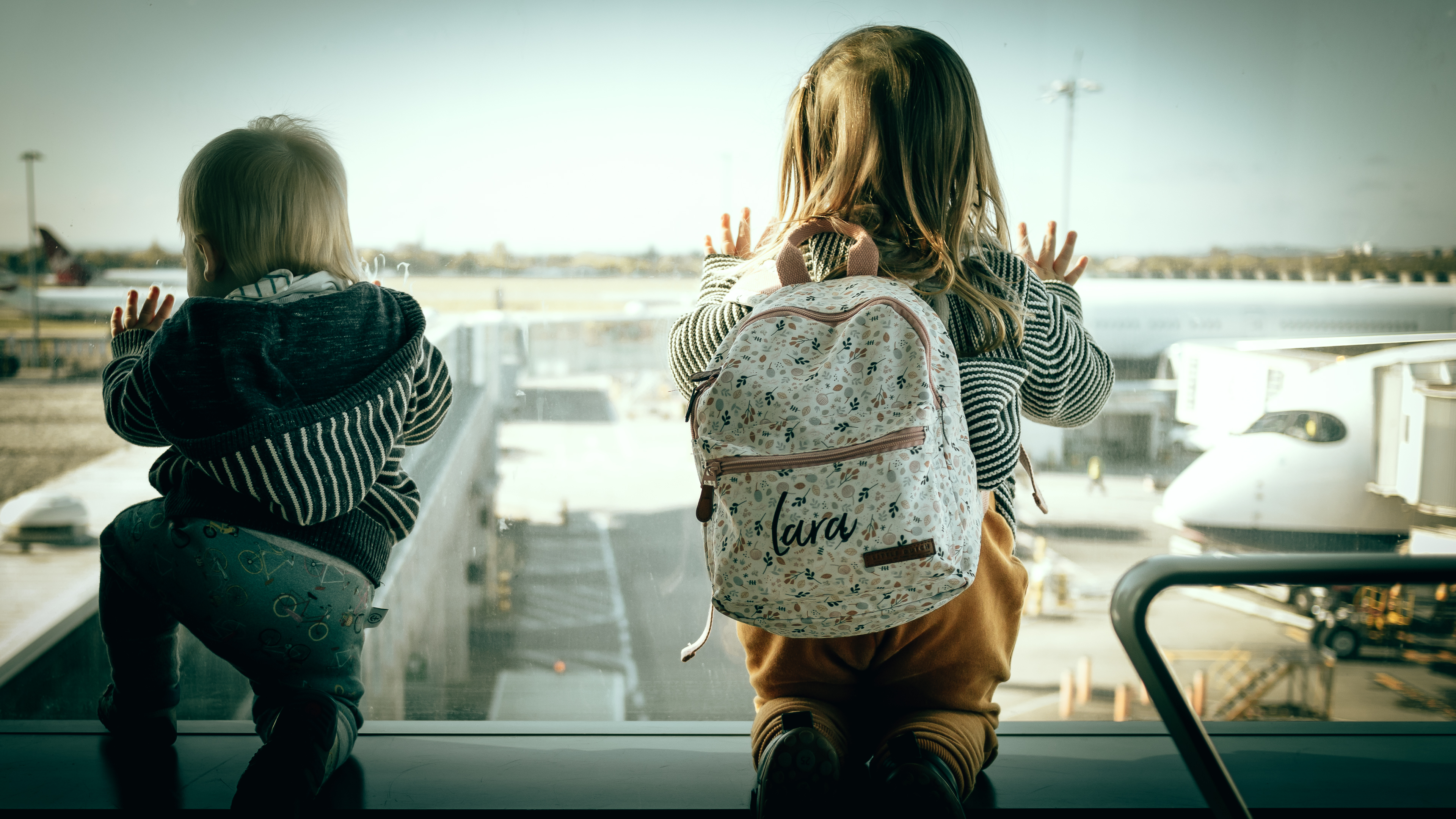 My children waiting to board our flight to Los Angeles